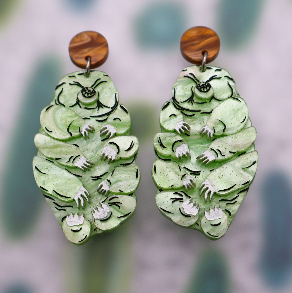 Tardigrade earrings handmade from green laser cut acrylic with brown earring toppers.