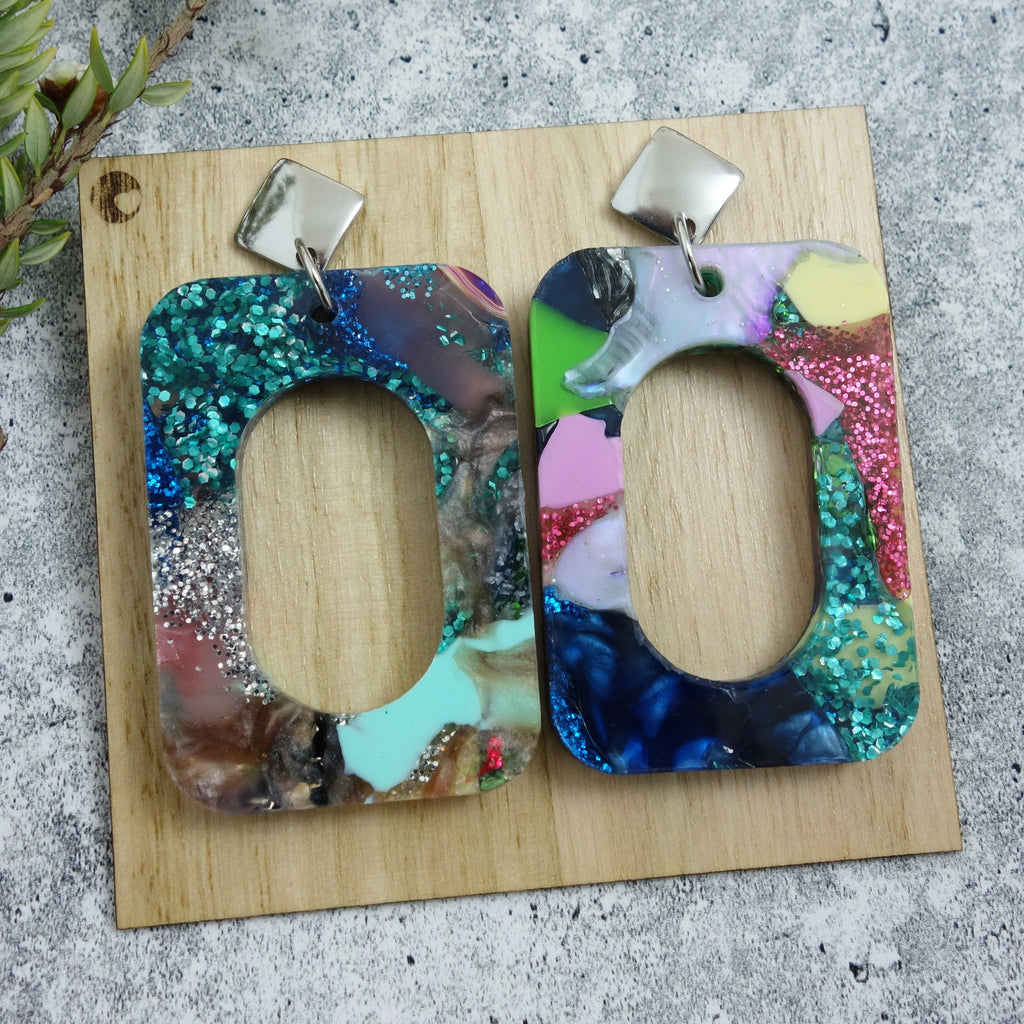 Statement sized earrings made from plastic acrylic scrap. Multicoloured and backed on a wooden earring card.