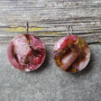 A pair of one of a kind round recycled acrylic earrings with stainless steel french hooks and pink and brown acrylics titled  'Dusky Petals'. Pair 101-16