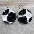 A pair of one of a kind recycled acrylic disc shaped earrings on stainless steel hoops with multicolored design titled 'Lunar Edge'. Pair 104-07