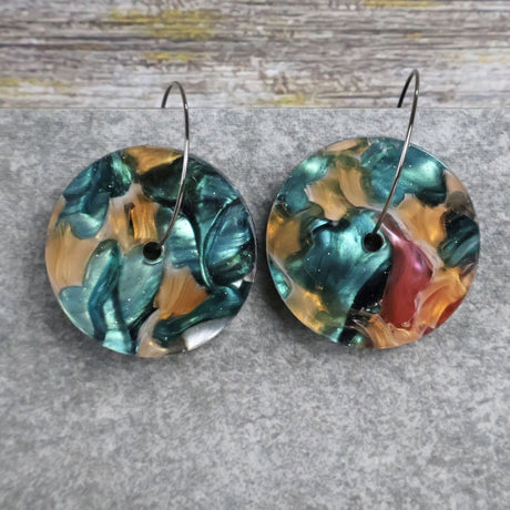 Pair of one of a kind disc acrylic earrings on stainless steel hoops with multicolored design titled 'Sunset Reef'. Pair 106-10