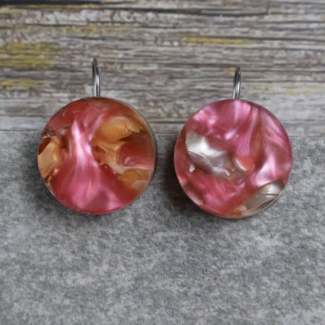 A pair of one of a kind round recycled acrylic earrings with stainless steel french hooks and multicolored design titled 'Sunset Reef'. Pair 106-14