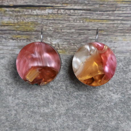 A pair of one of a kind round recycled acrylic earrings with stainless steel french hooks and multicolored design titled 'Sunset Reef'. Pair 106-16