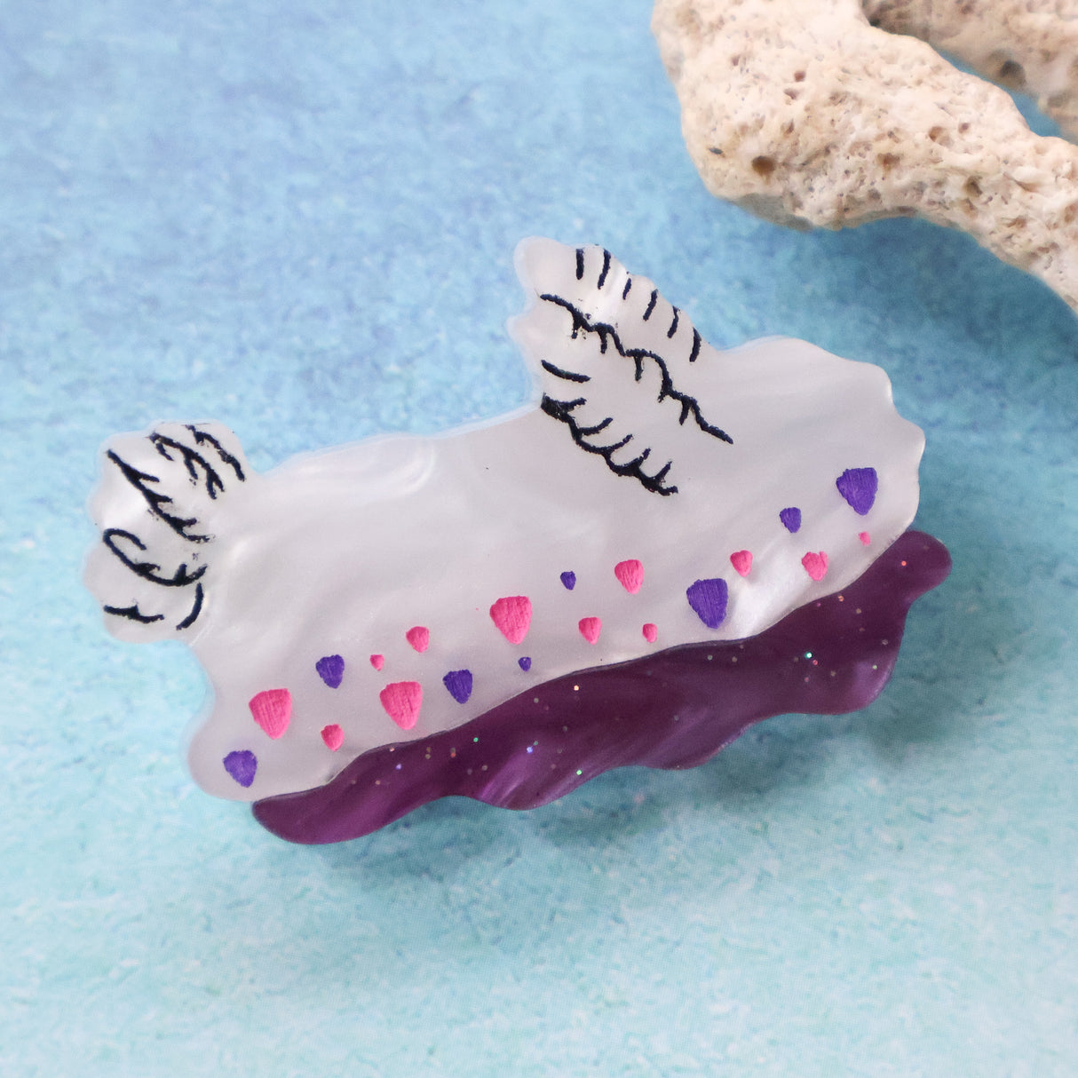 Small white purple and pink acrylic nudibranch brooch