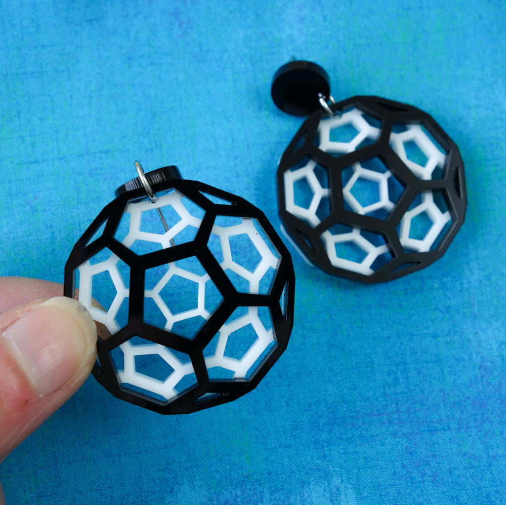 Black and white bucky ball earrings in laser cut acrylic