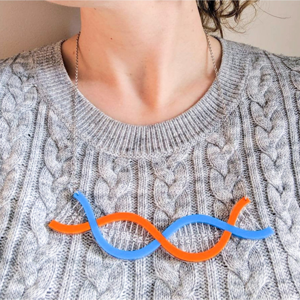 Blue and Orange DNA Acrylic necklace being modelled.