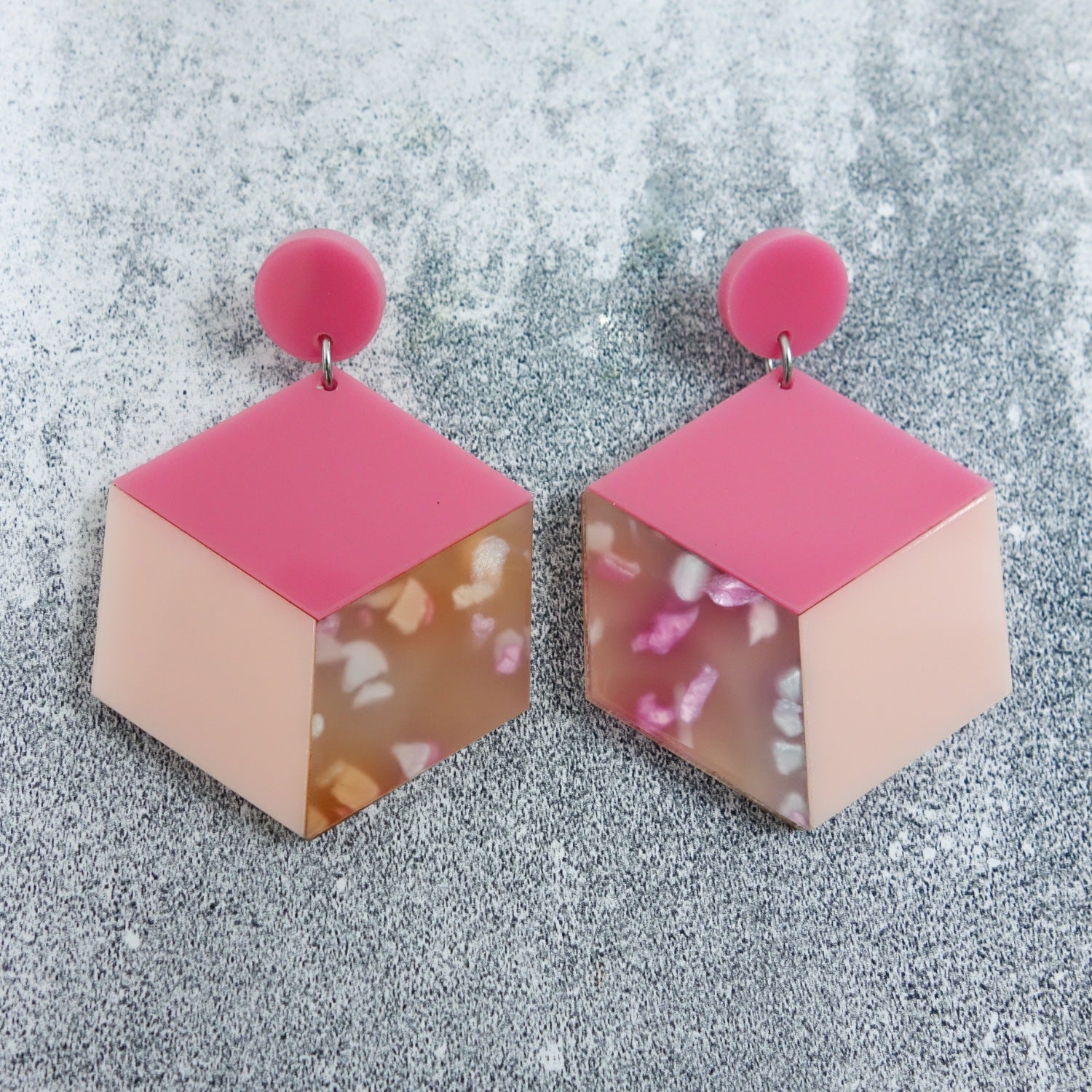 Laser cut acrylic statement cube earrings in pink colourway.