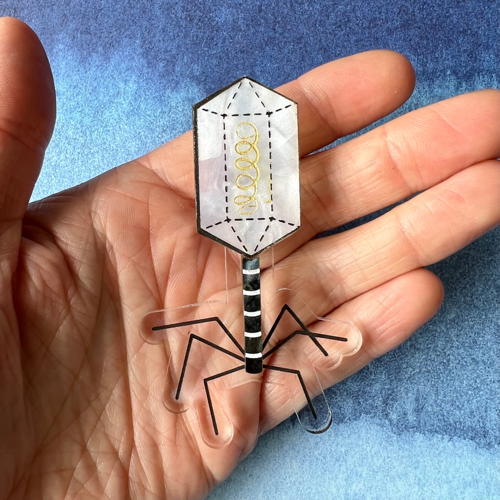 A virus (bacteriophage) brooch, handmade from laser cut acrylic.
