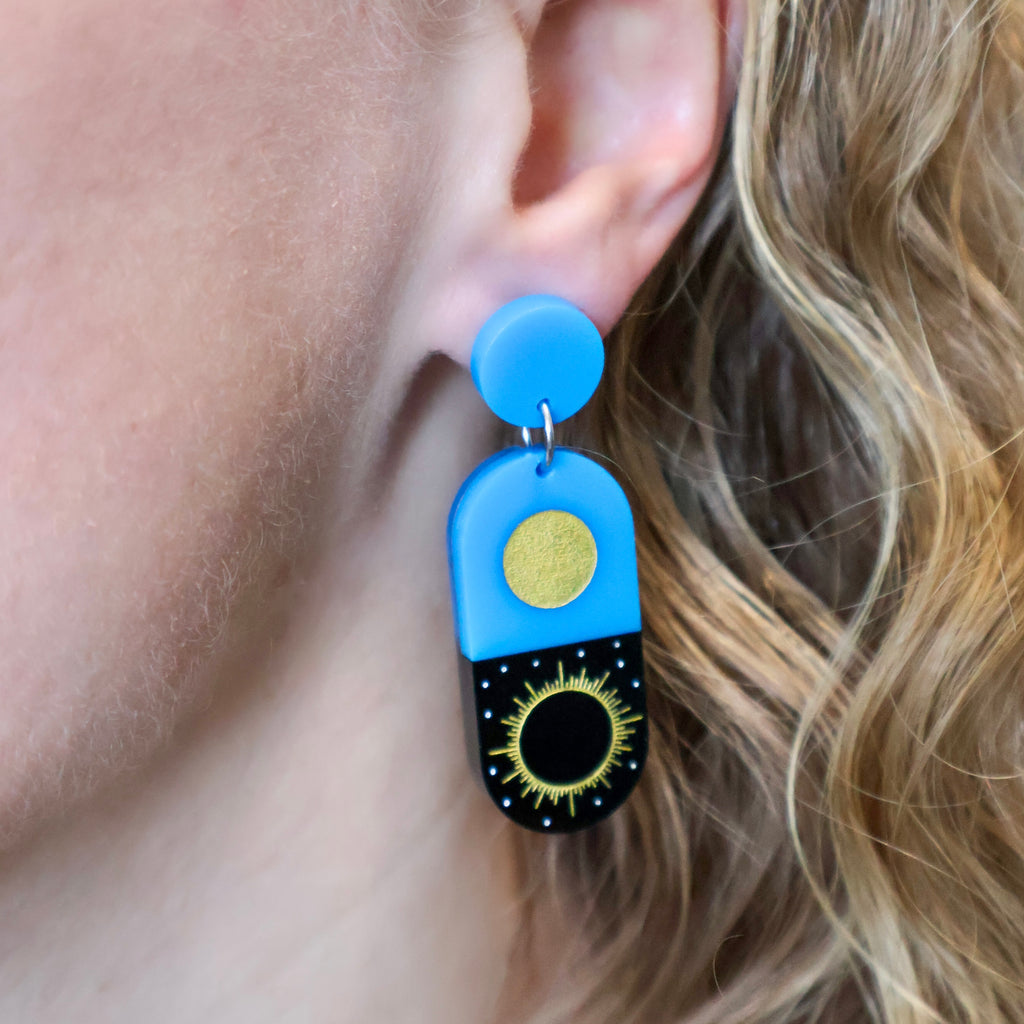Total solar eclipse earrings being modelled.