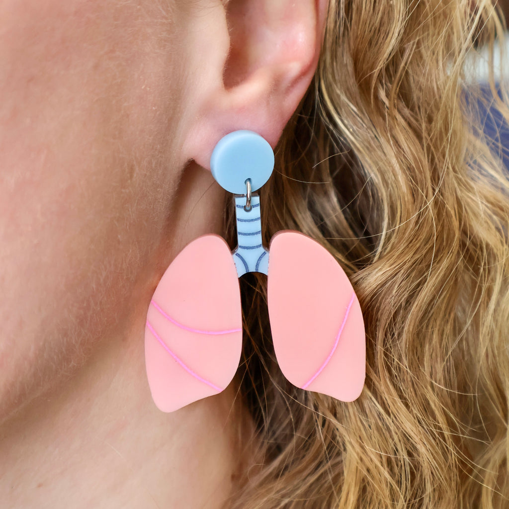 Anatomical lung earrings being modelled, Laser cut and handmade from acrylic. 