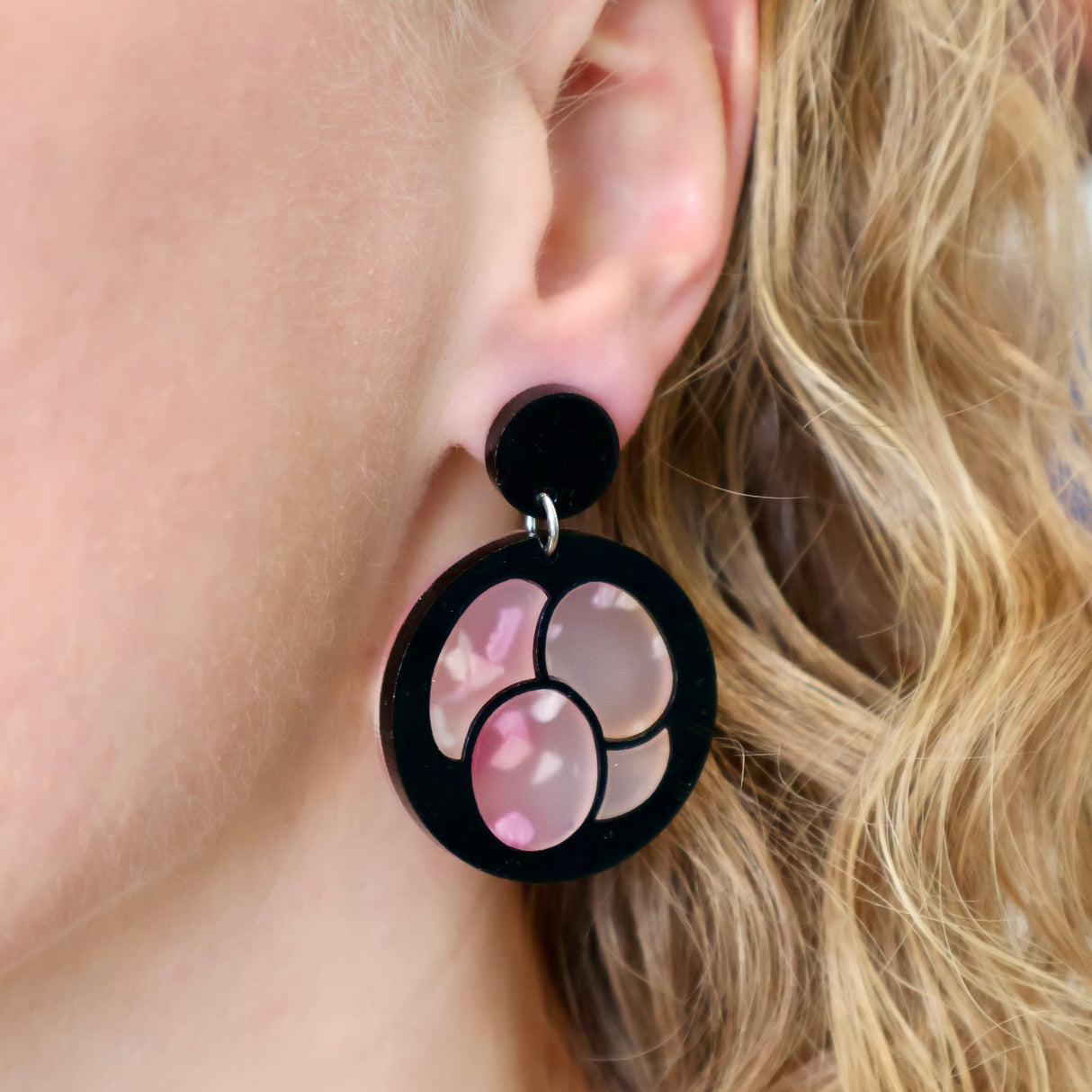 Laser Cut Acrylic Meiosis Earrings being modelled.