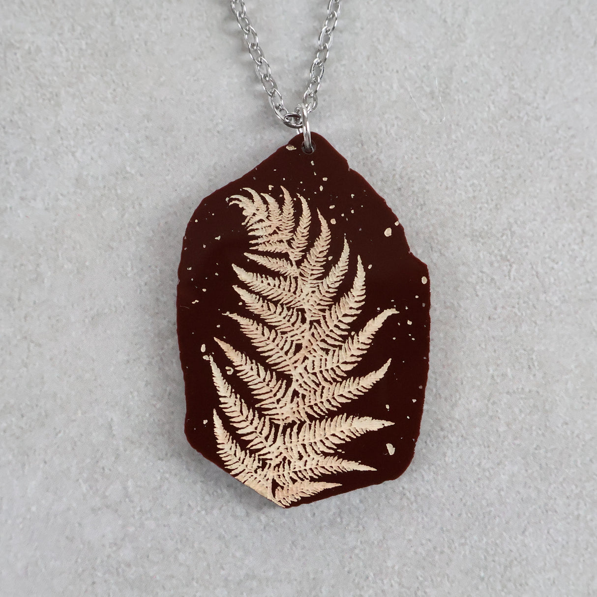 Acrylic fern leaf pendant necklace with stainless steel necklace chain. 