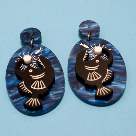 Acrylic anglerfish earrings angled view