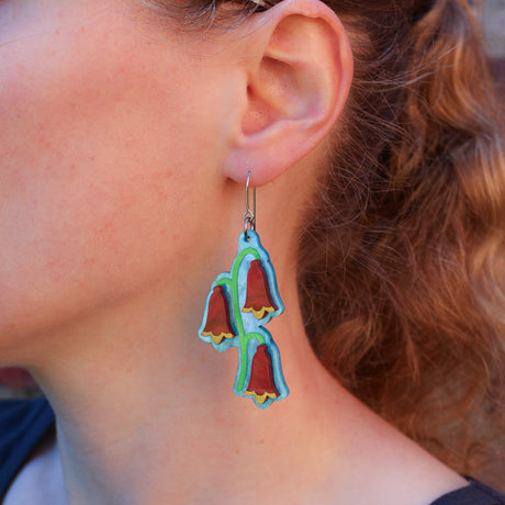 Christmas bell earrings modelled