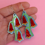 Christmas bells earrings in hand