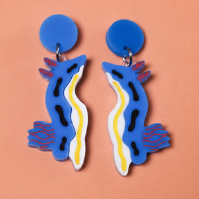 Chromodoris sea slug acrylic earrings up close. 
