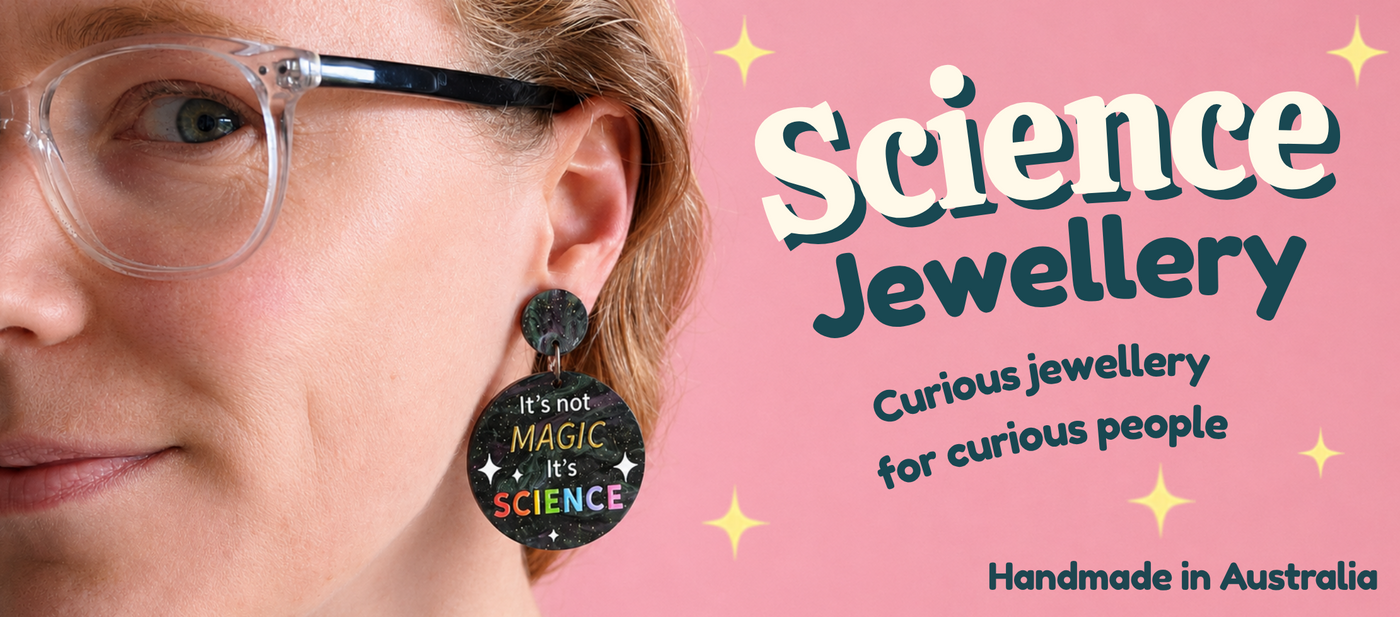 A banner showing a woman wearing a pair of earrings that says It's not Magic It's Science. Banner text reads Science Jewellery: Curious jewellery for curious people. Handmade in Australia