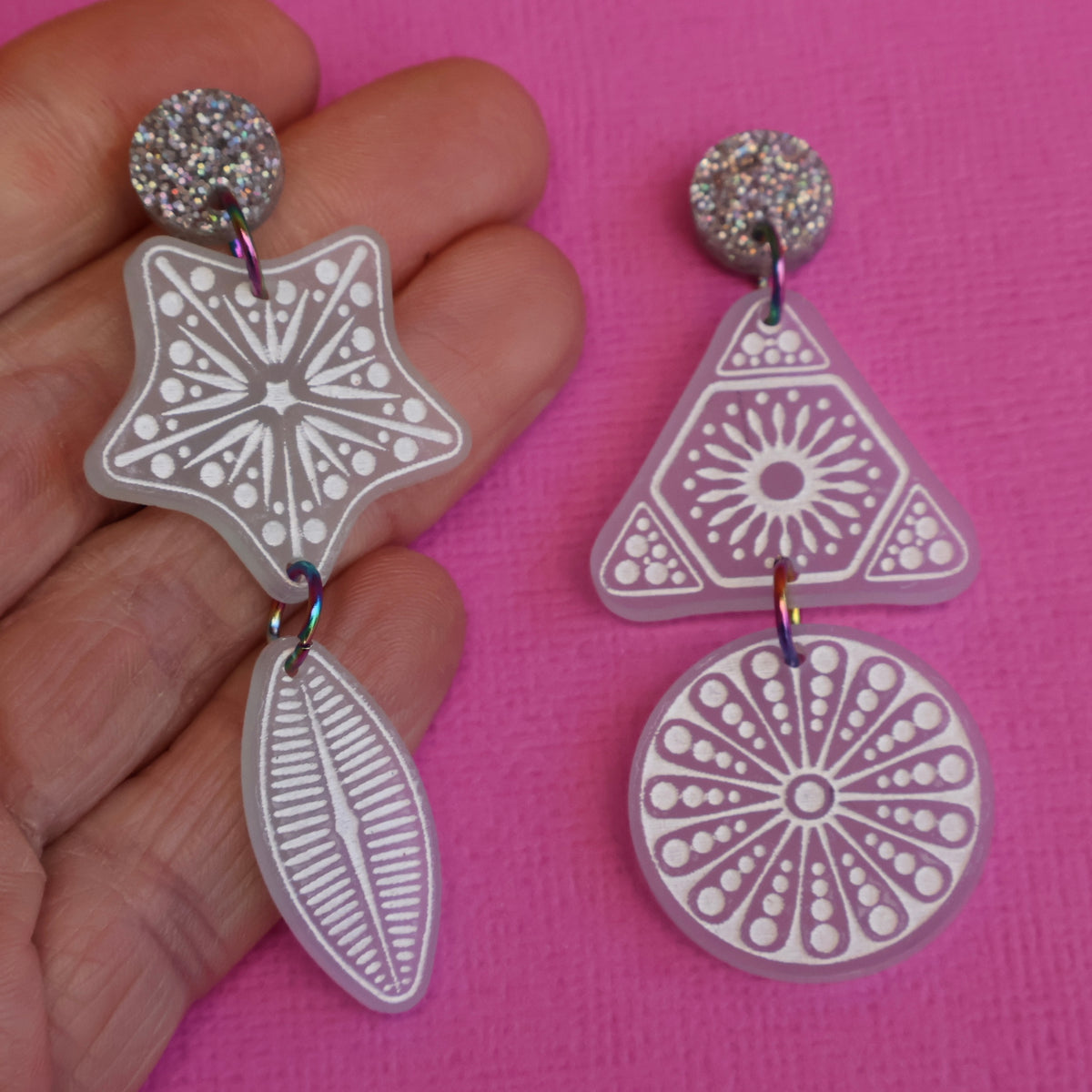 Acrylic diatom earrings in hand