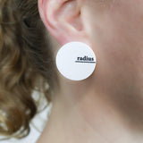 White asymmetrical acrylic studs with radius and diameter engraved and handpainted in black. Being modelled. 