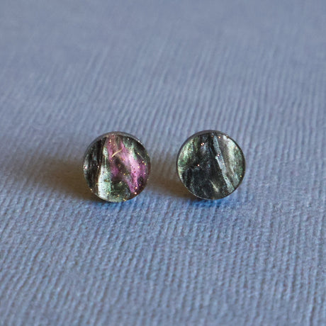 Round galactic swirl acrylic studs closeup