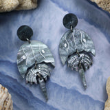 Laser cut acrylic horseshoe crab earrings,closeup.