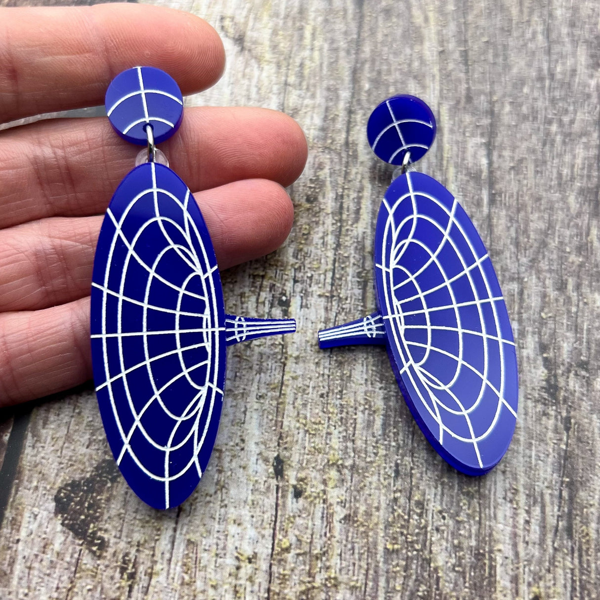 Dark blue dangle acrylic wormhole earrings, view 2.