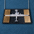 Statement acrylic necklace depicting the international space station, with stainless steel chain. 