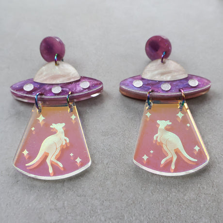 Pair of earrings with UFO design and kangaroo design in iridescent 'tractor' beam