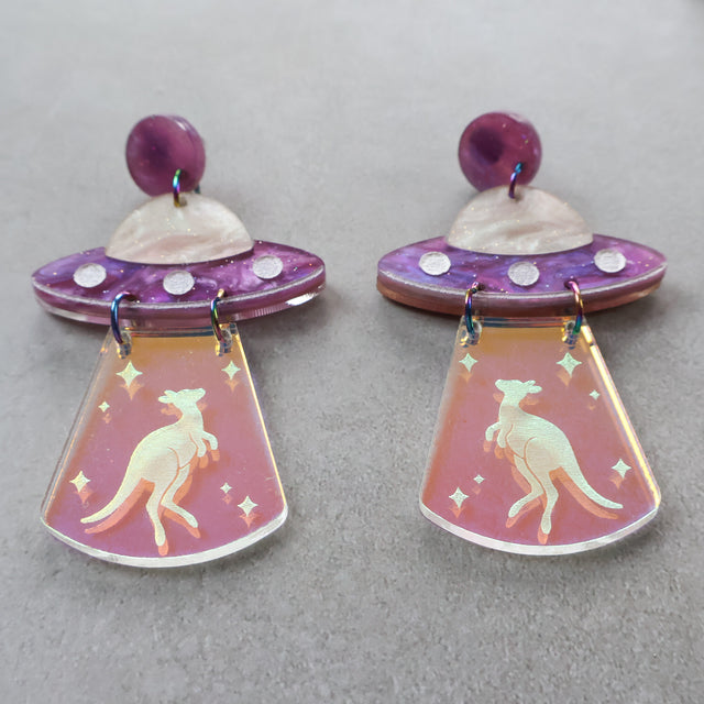 Pair of earrings with UFO design and kangaroo design in iridescent 'tractor' beam