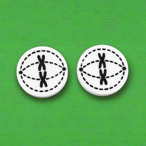 Pair of round black and white acrylic stud earrings with meiosis design.