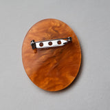 Back view of a Mosquito in amber acrylic brooch, showing stainless steel pin. 