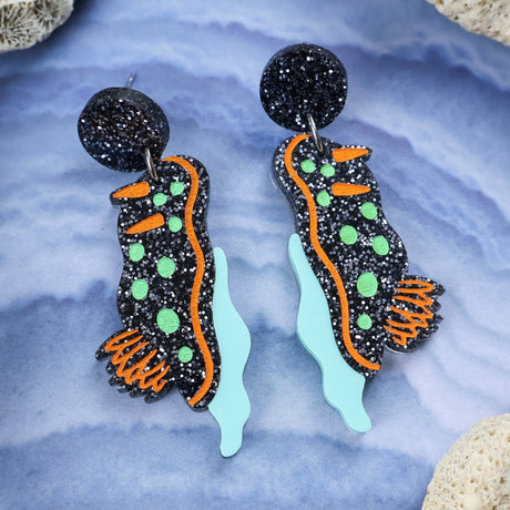 Laser cut acrylic nudibranch earrings,closeup.