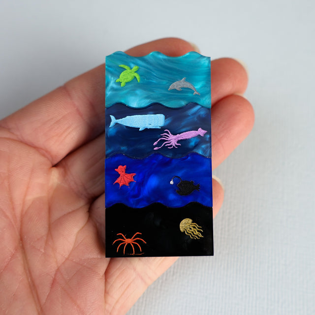 Ocean zones brooch in hand