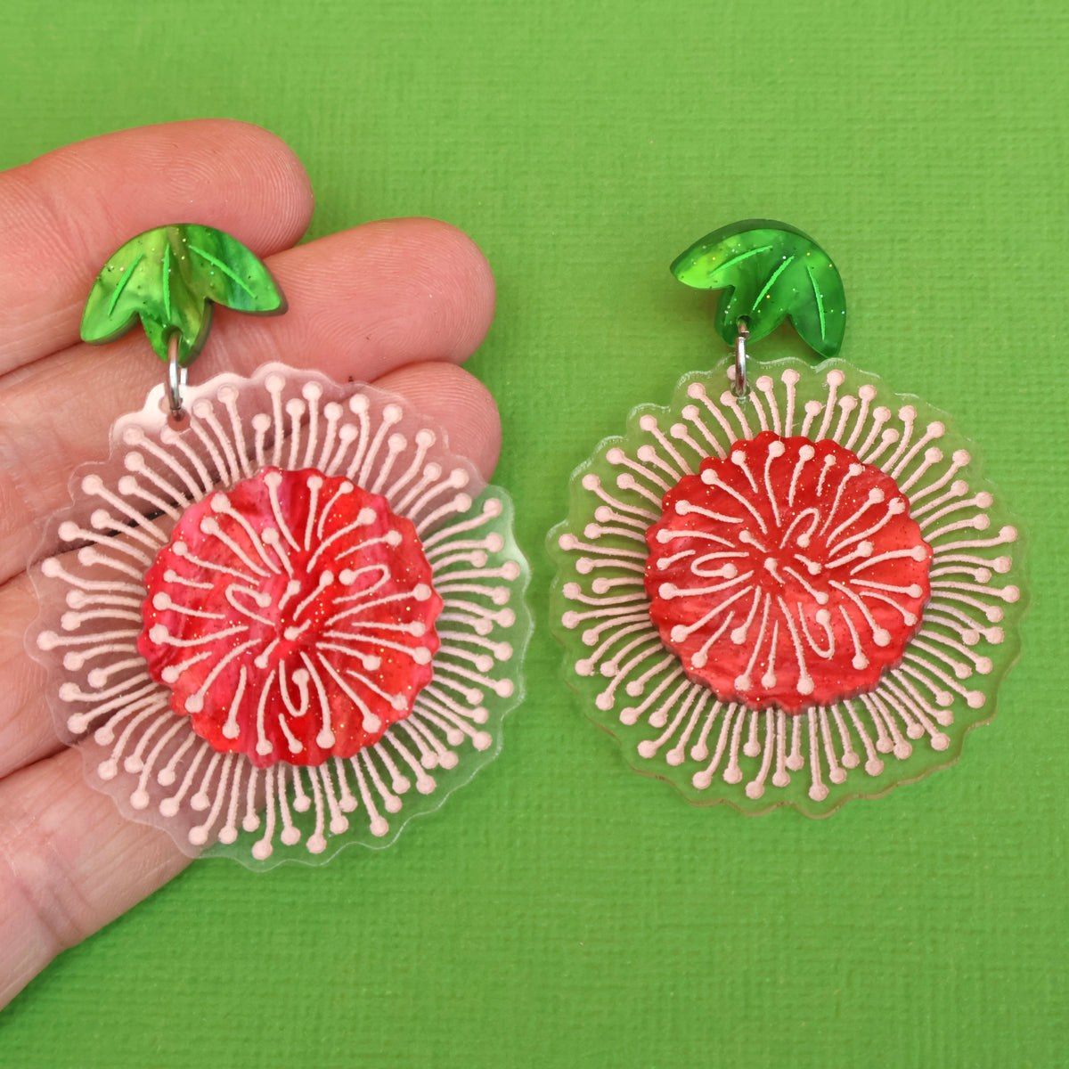 Pincushion Hakea earrings in hand
