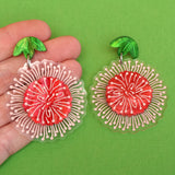 Pincushion Hakea earrings in hand