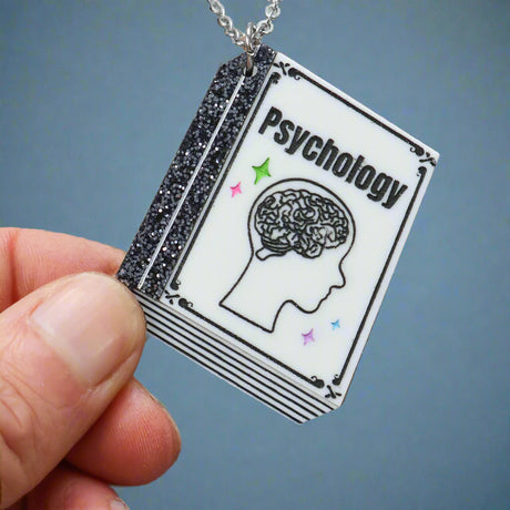Psychology textbook acrylic pendant necklace featuring a brain illustration 