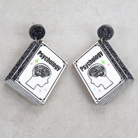 Book shaped acrylic earrings with 'Psychology' title. 