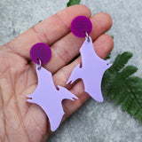 Purple pterosaur dangle earrings with darker purple toppers. Made from laser cut acrylic. 