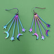 Multicolored star and moon-shaped earrings with stainless steel french hooks.