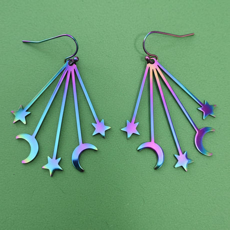 Multicolored star and moon-shaped earrings with stainless steel french hooks.