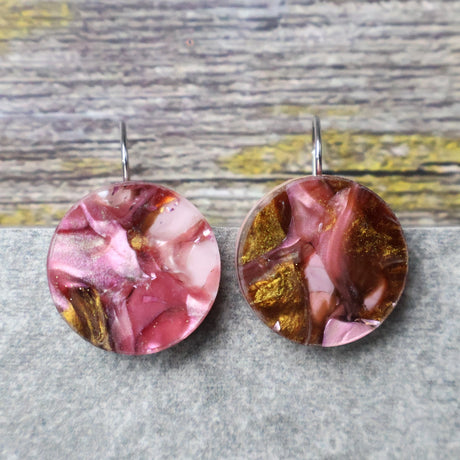 A pair of one of a kind round recycled acrylic earrings with stainless steel french hooks and pink and brown acrylics titled  'Dusky Petals'. Pair 101-19
