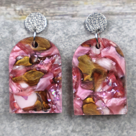 A pair of one of a kind arch shaped recycled acrylic earrings with pink and brown acrylics titled  'Dusky Petals' and stainless steel toppers. Pair 101-01