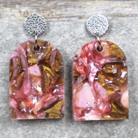 A pair of one of a kind arch shaped recycled acrylic earrings with pink and brown acrylics titled  'Dusky Petals' and stainless steel toppers. Pair 101-02