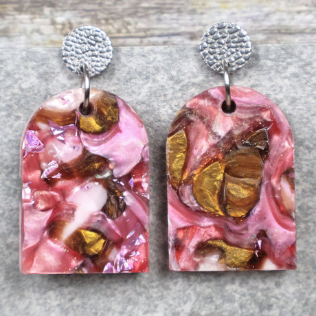 A pair of one of a kind arch shaped recycled acrylic earrings with pink and brown acrylics titled  'Dusky Petals' and stainless steel toppers. Pair 101-03