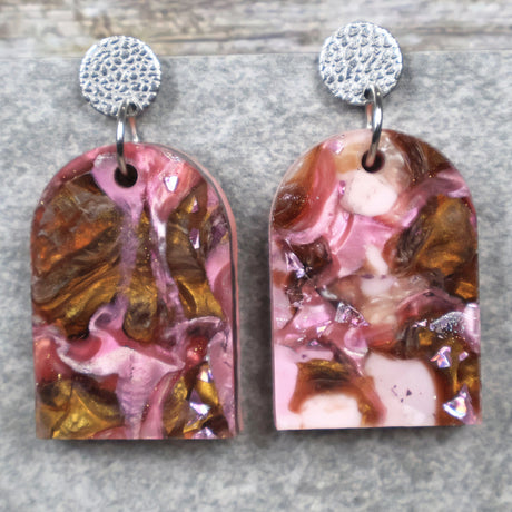 A pair of one of a kind arch shaped recycled acrylic earrings with pink and brown acrylics titled  'Dusky Petals' and stainless steel toppers. Pair 101-04