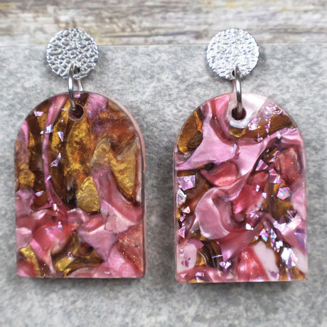 A pair of one of a kind arch shaped recycled acrylic earrings with pink and brown acrylics titled  'Dusky Petals' and stainless steel toppers. Pair 101-0