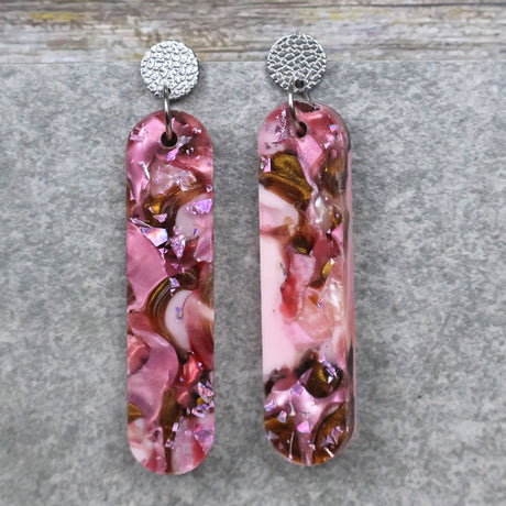 A pair of one of a kind long oval shaped recycled acrylic earrings with pink and brown acrylics titled  'Dusky Petals' and stainless steel toppers. Pair 101-09