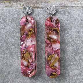 A pair of one of a kind long oval shaped recycled acrylic earrings with pink and brown acrylics titled  'Dusky Petals' and stainless steel toppers. Pair 101-10