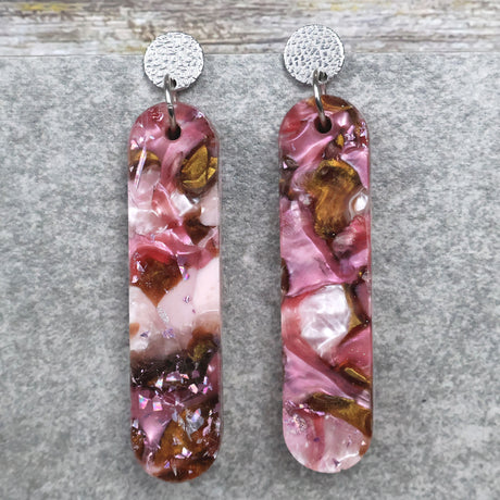 A pair of one of a kind long oval shaped recycled acrylic earrings with pink and brown acrylics titled  'Dusky Petals' and stainless steel toppers. Pair 101-11