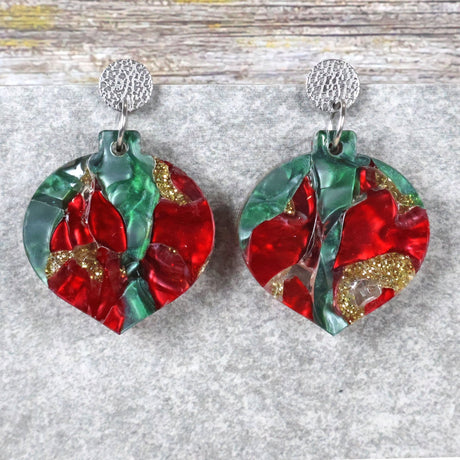 A pair of one of a kind recycled acrylic Christmas bauble earrings with stainless steel toppers, featuring a red, green and gold acrylic design. Pair 108-01